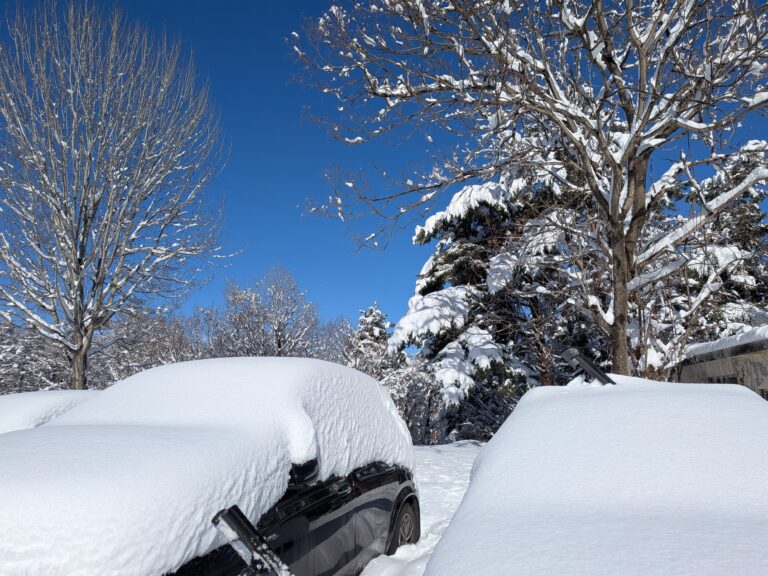 Car covered in snow at Kijimadaira